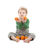 Baby with oranges