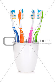 Four colorful toothbrushes