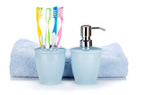 Toothbrushes, liquid soap and towel