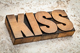 kiss word in wood type
