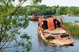 Wrecked abandoned ship on a river