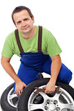 Car mechanic with tires