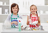 Happy kids helping in the kitchen