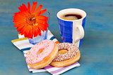 breakfast with black coffee and donuts