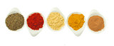 row of spices on white