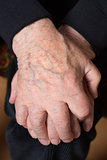 Hands of an old senior adult