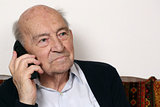 Senior adult with a telephone