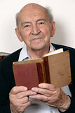Portrait of a senior man reading a book