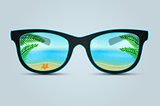 Summer sunglasses with beach reflection