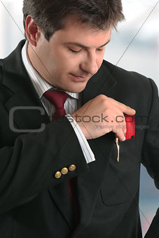 Man businessman holding credit card or other plastic card