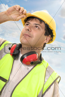 Engineer or builder looking up at progress