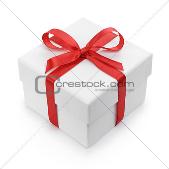 white textured gift box with red ribbon bow