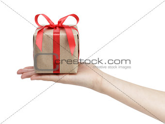 small gift box with ribbon bow in female hand