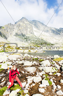 woman backpacker at Five Spis Tarns, Vysoke Tatry (High Tatras),