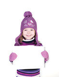 cute little girl in warm clothes showing empty copy space