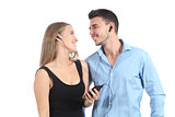 Attractive couple sharing music with a headphones