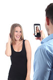 Man making photograph of a girl with a mobile phone