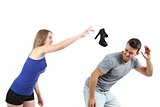 Woman throwing a heel shoe to a man
