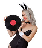 Playful blonde in a bunny suit with a vinyl record