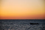 Alone boat in sunset