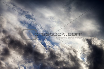 Sky with sunlight and dark clouds