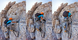 Young boy climbing a via ferrata in the Italian Dolomites.