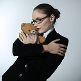 business woman huging teddy bear