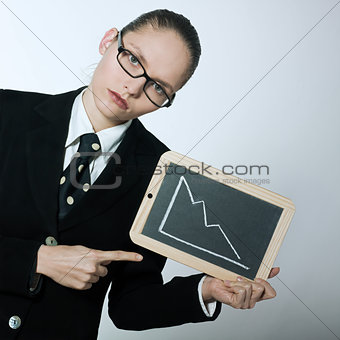 serious business woman holding graphic board with deacreasing cu