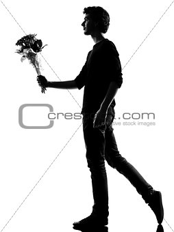 young man silhouette offering flowers bouquet