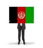 Businessman holding a big card, flag of Afghanistan