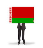Businessman holding a big card, flag of Belarus
