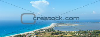 Sea coast panorama and kiteboarders.
