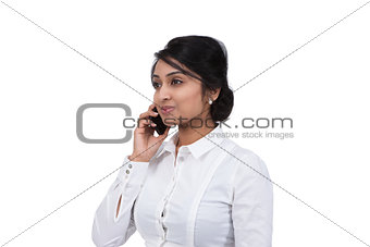 Side view of an Asian businesswoman talking on cell phone