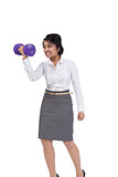 Angry Asian businesswoman holding a dumbbell