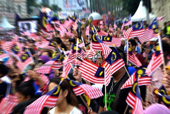 People Waving Malaysian Flags