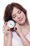 Woman holding alarm clock