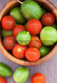 Assorted fresh colorful cucumbers and  cherry tomatoes