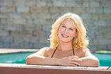 Happy blond girl in pool