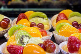 Lemon Custard Tarts with Fruits Closeup