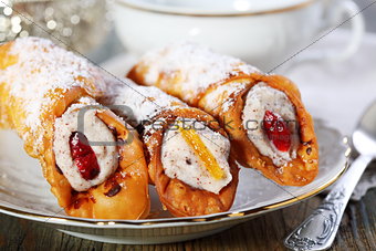 Roll with cream and candied fruit.