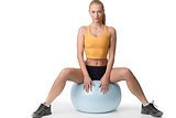 girl blond sitting on fitness ball