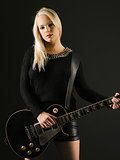 Gorgeous blond playing electric guitar
