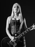Blond playing electric guitar black and white