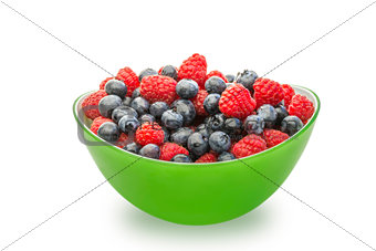 Fresh blueberries and raspberries in a green bowl