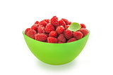 Raspberries in a green bowl