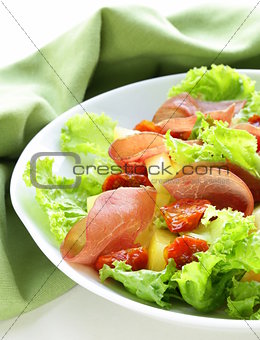 fresh green snack salad with ham and vegetables