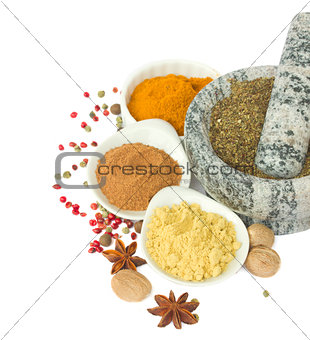 mortar with  spices isolated on white