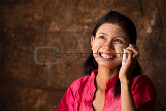 Myanmar girl using smart phone.