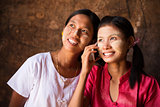 Two Myanmar girls using smart phone.
