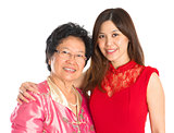 Asian senior mother and adult daughter